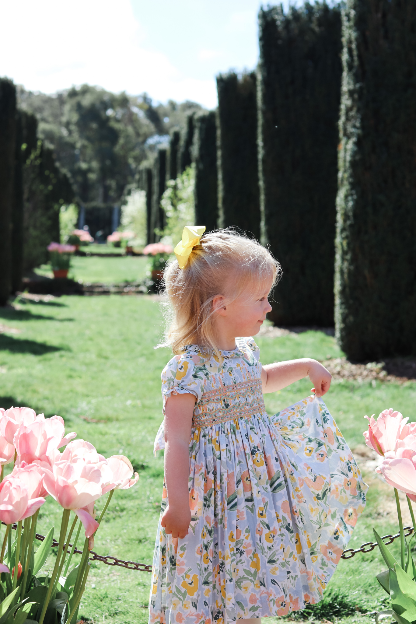 Charlotte sy Dimby classic timeless traditional smocked dresses for babies and girls handmade French style children clothing paris boutique floral print spring easter dress filoli garden photo shoot california